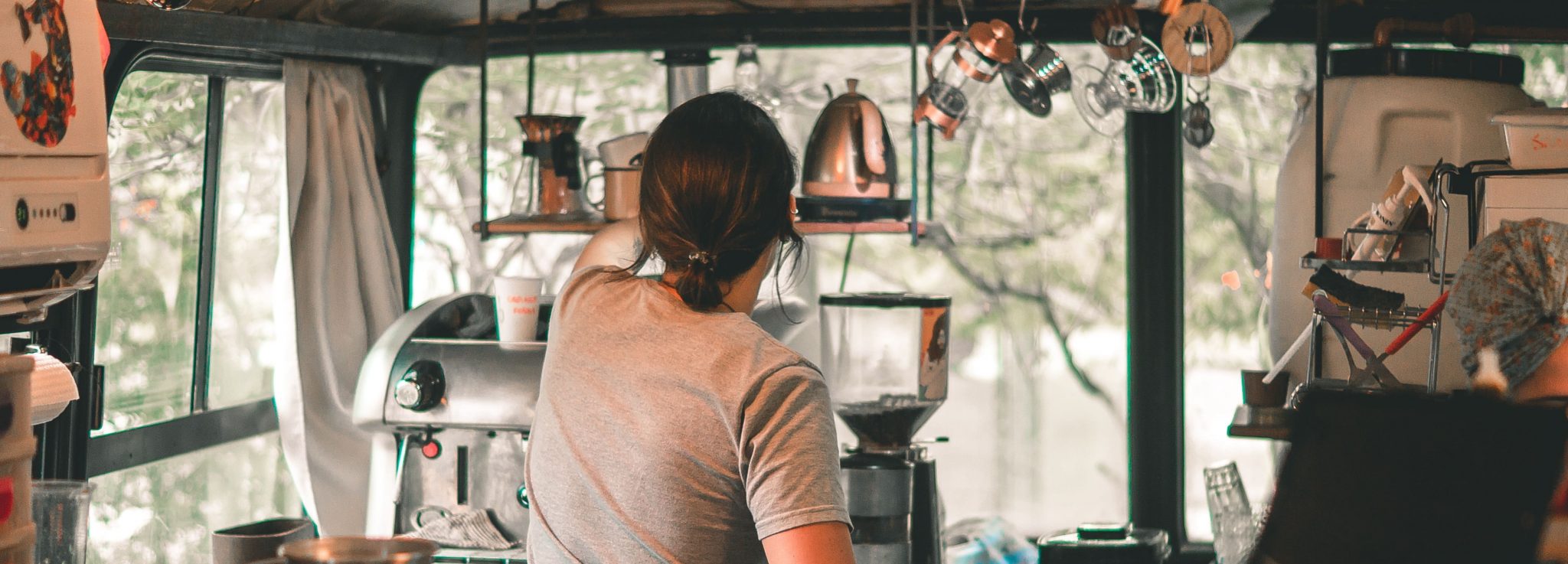 A woman working in a coffee cart